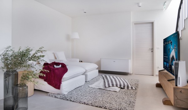 A modern, air-conditioned corner for playing and relaxing in a Croatian villa for vacation and rental by the sea and the beach on the island of Pag for 7 people with a swimming pool and priva