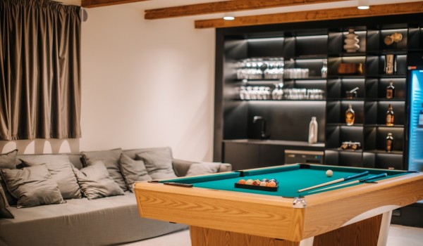 View of the pool table in a modern air-conditioned room with a wine bar and Sat TV in an exclusive villa for rent with a swimming pool, sauna and jacuzzi in Novalja on the island of Pag