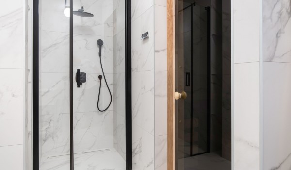 En suite bathroom in neutral tones with walk-in shower in a private villa for family vacation Summer Dream Privacy Novalja with swimming pool and sauna on the island of Pag