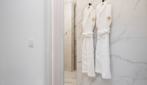 Soft robes in the modern bathroom of a luxury Croatian villa for rent on the island of Pag with a pool and private parking