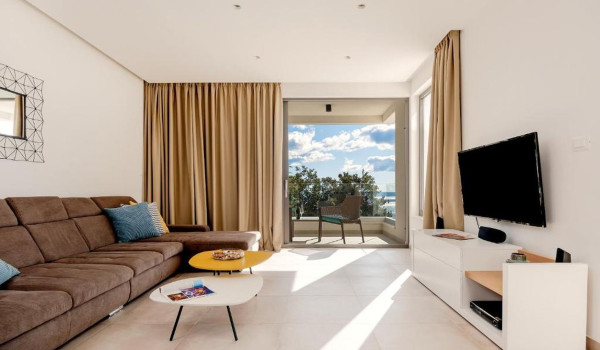 Spacious luxury living room with sea view and access to the balcony on the floor of the Croatian luxury villa White Diamond