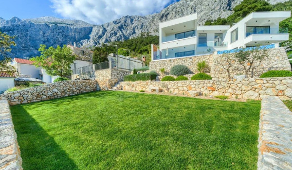 Private, fully fenced courtyard of a Croatian luxury villa for a family vacation in Baška Voda