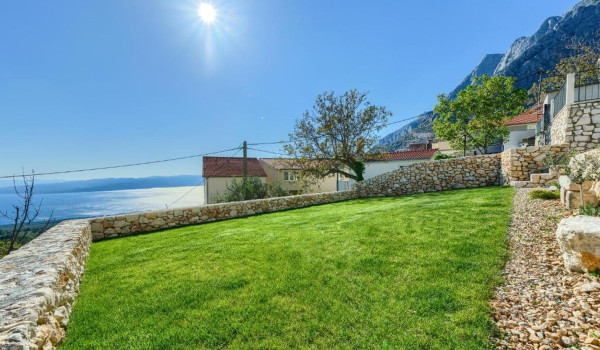Private, fully fenced courtyard of a Croatian luxury villa for a family vacation in Baška Voda