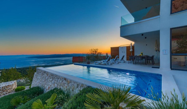 Exterior of Croatian luxury villa White Diamond with heated pool in beautiful sunset