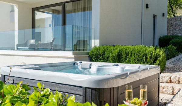 Jacuzzi on the outdoor terrace with a view on the property of the Croatia luxury villa for a vacation with friends White Diamond