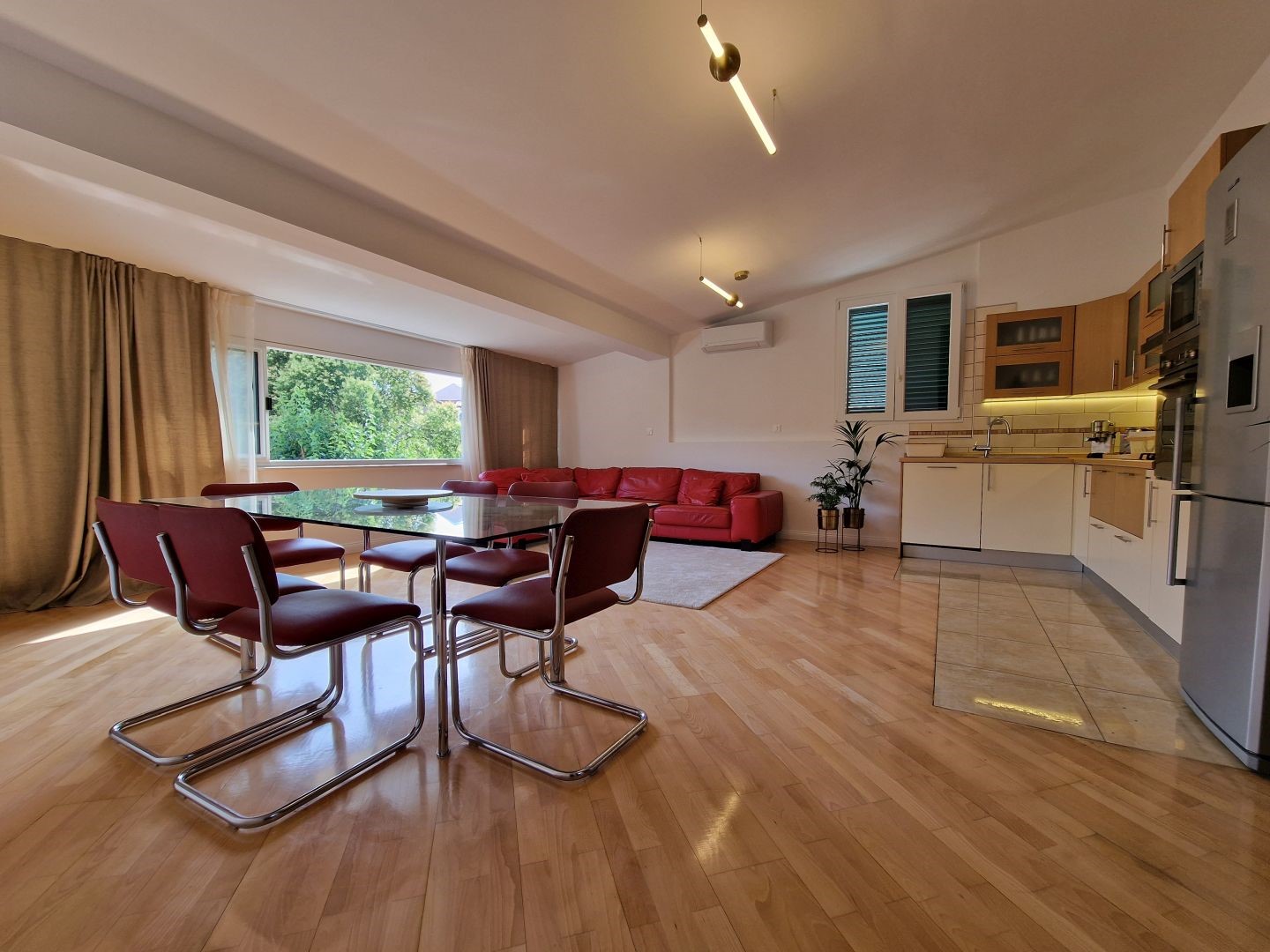 Spacious living room, fully equipped kitchen and dining room inside a luxury Croatian apartment in Split
