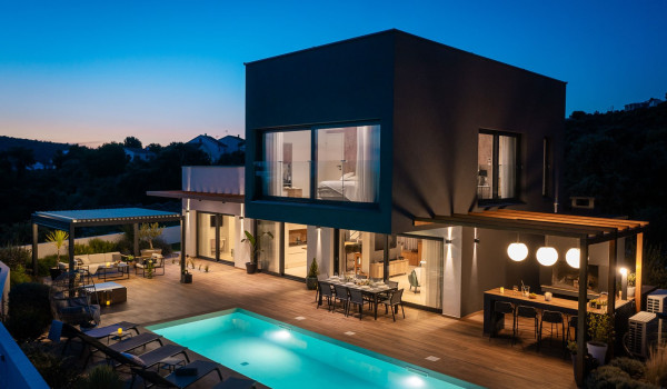 Night photo of the illuminated pool of the luxury villa for rent and vacation Indigo in Razanj