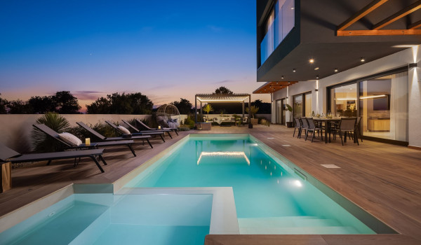 Private illuminated pool in the fenced terrace of the Croatia modern rental villa Indigo near Rogoznica