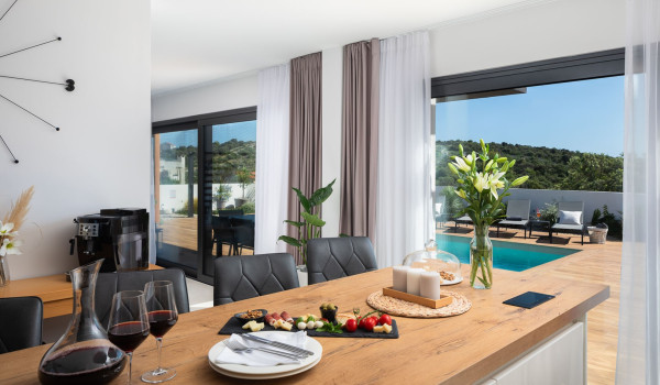 Served snack on the kitchen island on the ground floor of the modern family villa for rent Indigo near Rogoznica