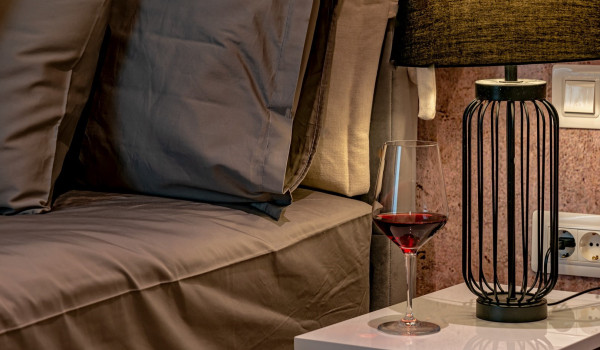 Lamp on the nightstand next to the comfortable king size bed in the bedroom of the rental home for vacation Indigo near Rogoznica