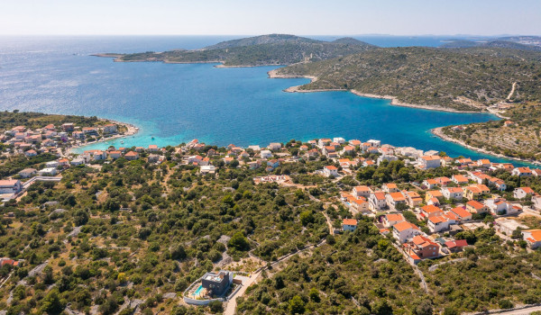 Aerial shot of the propery of the luxury pet-friendly villa for rent Indigo and it's proximity to the beach and sea