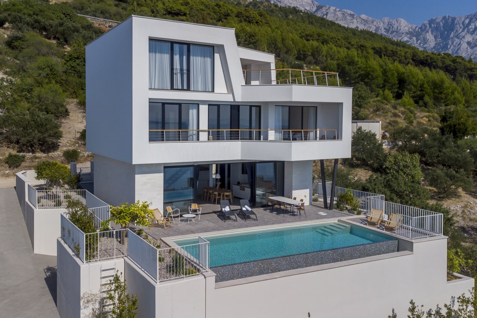 View of the Croatia luxury holiday villa for family holidays with private pool and outdoor terrace with sunbeds Brela 2 in Brela