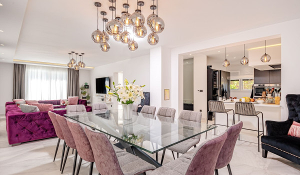 Spacious living area with dining table and chairs and a comfortable sofa in the living room