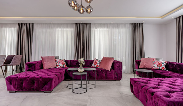 Seating area in the modern living room next to the dining room inside Croatian luxury holiday villa