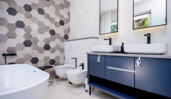 Modern interior of en suite bathroom with bathtub inside Croatian luxury holiday villa