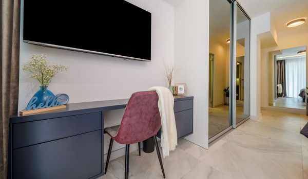Seating area under the LCD TV in the bedroom of the luxury villa Velvet Bourbon Split