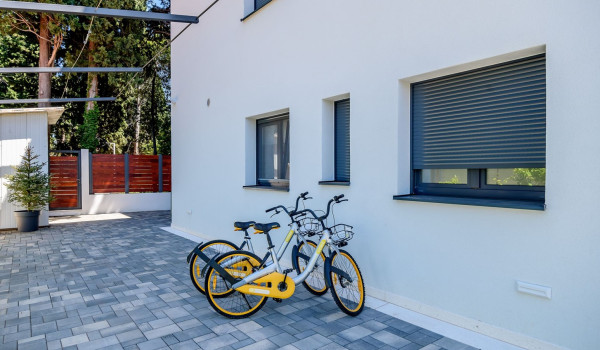 Place to park bicycles in the fenced yard in front of the villa for rent and holiday with  pool