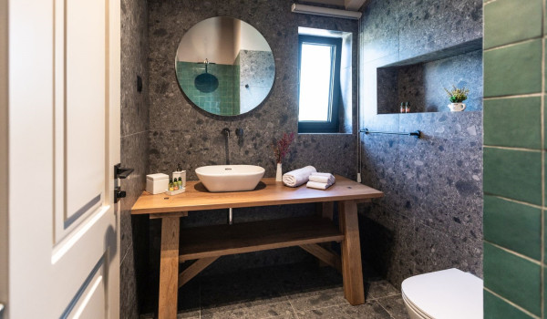 A view of a modern en-suite bathroom with a walk-in shower in a luxury holiday home
