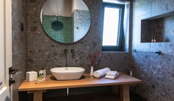 A view of a modern en-suite bathroom with a walk-in shower in a luxury holiday home