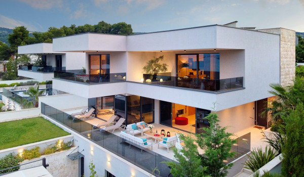 View of the garden and property of the modern vacation villa Thalia with an indoor pool in Marina