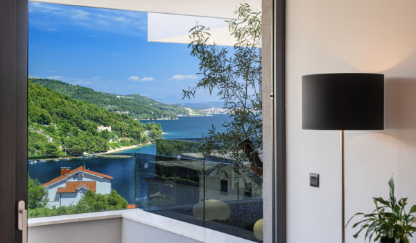 Sea view from the balcony of the bedroom in the luxury Dalmatian villa for vacation Thalia with an indoor pool