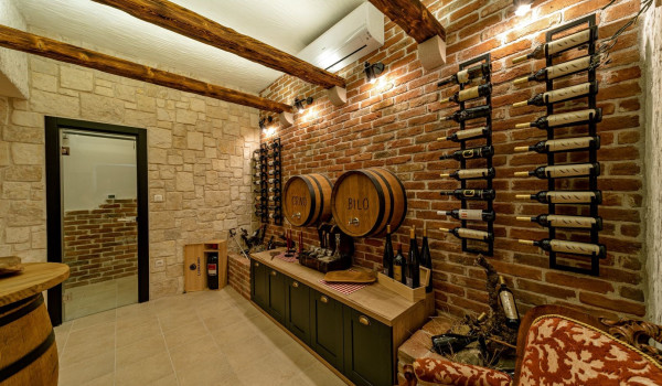Charming interior of the tavern within the villa for rent and vacation Thalia