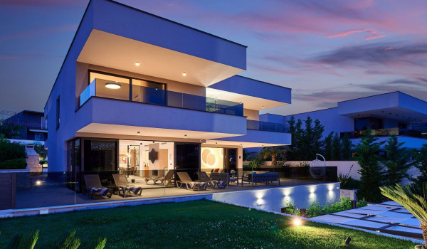 Night shot of the property of the private Croatian villa Thalia with an indoor pool in Marina