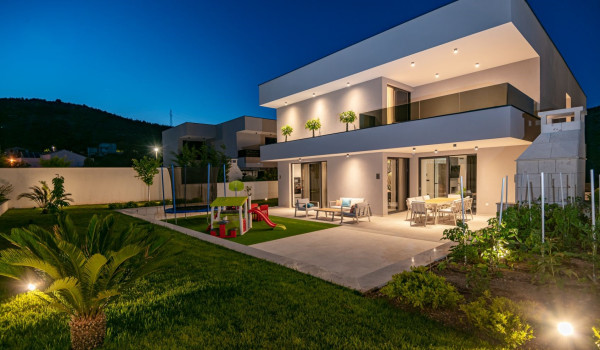 Night shot of the private fenced priperty of the villa for rent Thalia