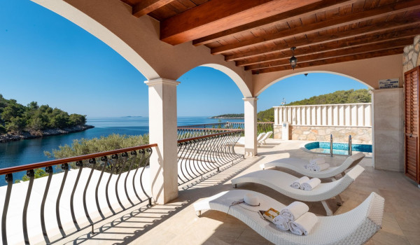 Sun loungers by the pool of the luxury vacation villa Korcula Magnificent with concierge service