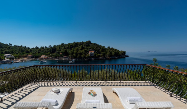 Sun loungers by the pool of the luxury vacation villa Korcula Magnificent with concierge service