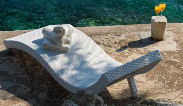 Deck chair on the private dock in front of the luxury Korcula villa for family vacation by the sea