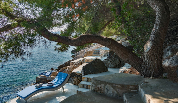 Deck chair on the private dock in front of the luxury Korcula villa for family vacation by the sea