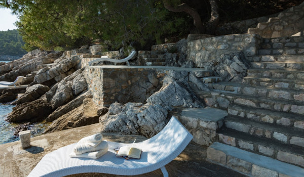 Deck chair on the private dock in front of the luxury Korcula villa for family vacation by the sea