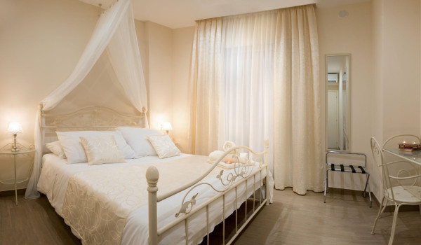 Elegant bed with baldachin in a bedroom of a luxury Korcula villa with sauna and heated pool