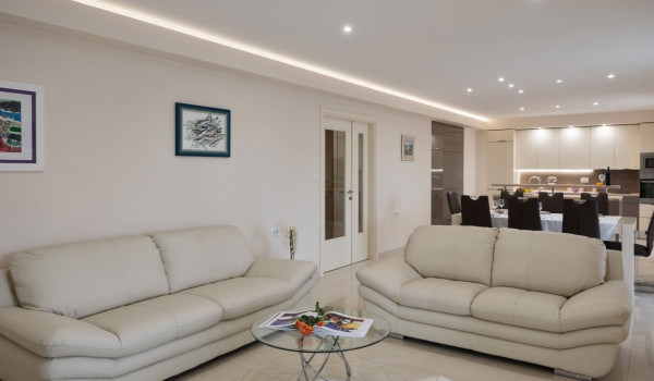 Comfortable sofas in the living room of a luxury holiday villa with heated pool and sauna
