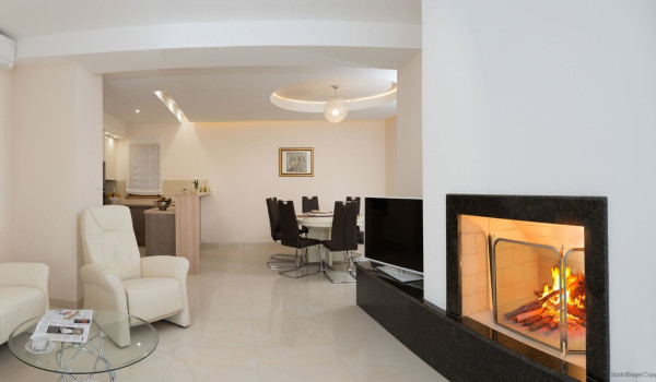 Fireplace in the living room of the luxury vacation villa Korcula Magnificent with concierge service and parking