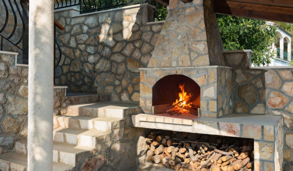 Traditional outdoor grill on the terrace of the luxury beachfront villa for vacation with friends and family