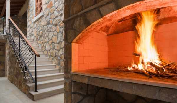 Traditional outdoor grill on the terrace of the luxury beachfront villa for vacation with friends and family