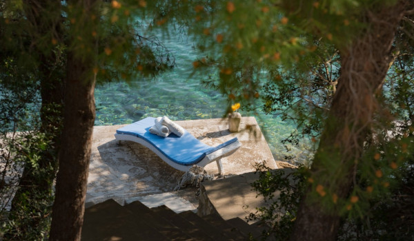 Deck chair on the private dock in front of the luxury Korcula villa for family vacation by the sea