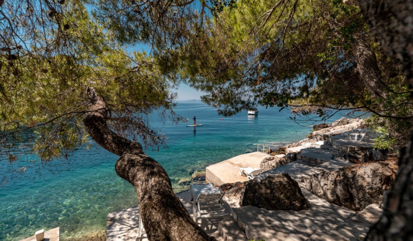 Private mooring dock in front of the luxury vacation villa by the sea on Korcula island