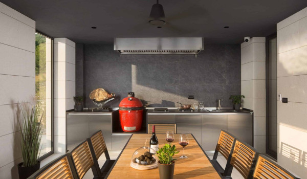 Outdoor dining area with barbecue in luxury istrian luxury villa for vacation