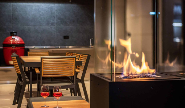 Outdoor dining area with barbecue in luxury istrian luxury villa for vacation