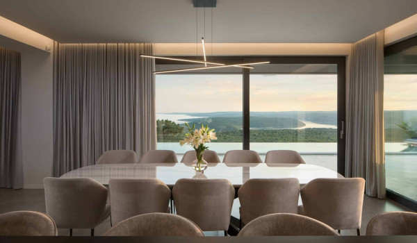Open space  concept of first floor that consists of living room, dining room and kitchen in istrian luxury villa for family and vacation