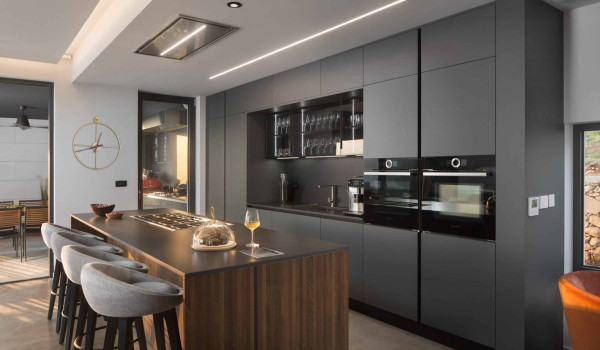 Fully equipped kitchen with kitchen island in luxury croatian villa with concierge service    for vacation and rent