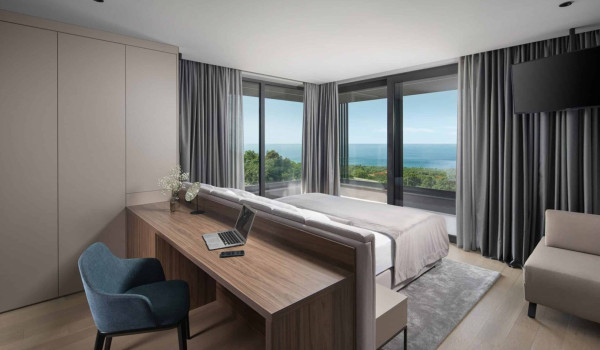 Bedroom with king size bed and en suite bathroom with shower in istrian luxury family villa