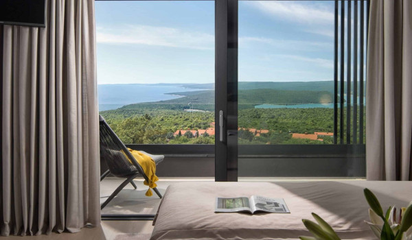 Bedroom with king size bed and en suite bathroom with shower in istrian luxury family villa