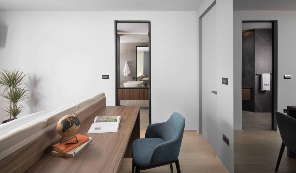 Bedroom with king size bed and en suite bathroom with shower in istrian luxury family villa