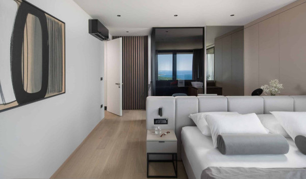 Bedroom with king size bed and en suite bathroom with shower in istrian luxury family villa