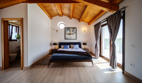 Luxurious, spacious bedroom with king-size bed and en-suite bathroom with walk-in shower