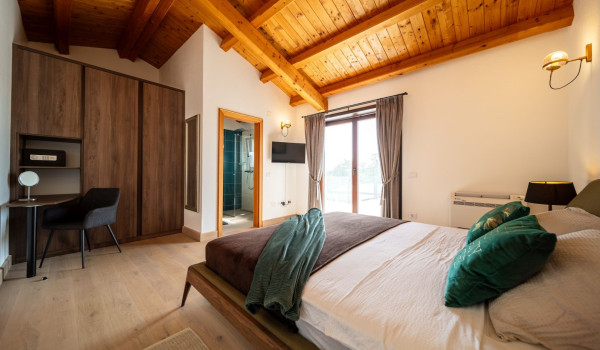 Luxurious, spacious bedroom with king-size bed and en-suite bathroom with walk-in shower